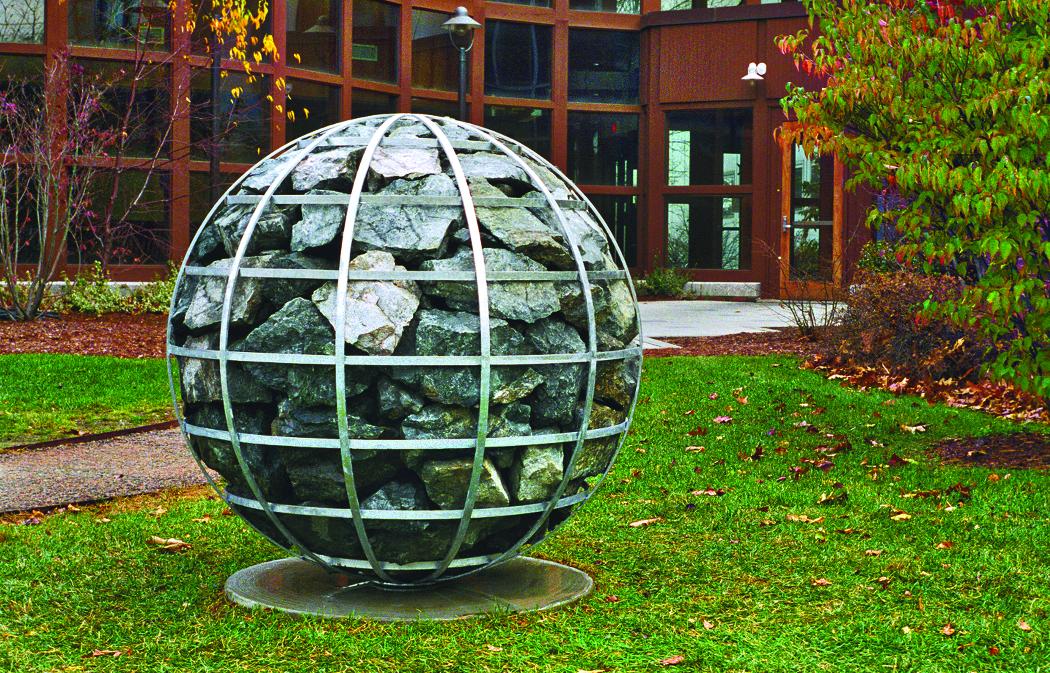 Cairn, which is in the collection of Jackson Laboratory in Bar Harbor and is based on ancient stone markers found in Europe, was made using welded and galvanized steel and huge granite rocks. Photo courtesy of Celeste Roberge