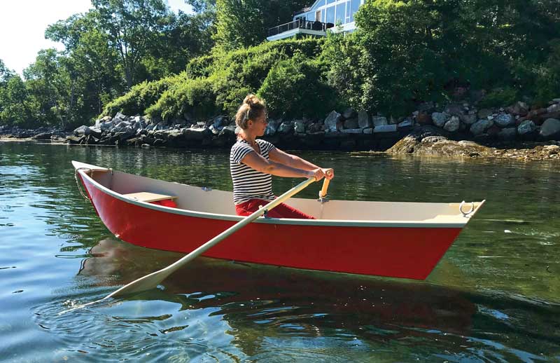 Jessica Lee Ives takes a break from making art by rowing to Laite Beach in the rowboat built by her husband, Jonathan Ives. The oarlock in the quarter knee offers passengers a way to steer the boat using a third oar.